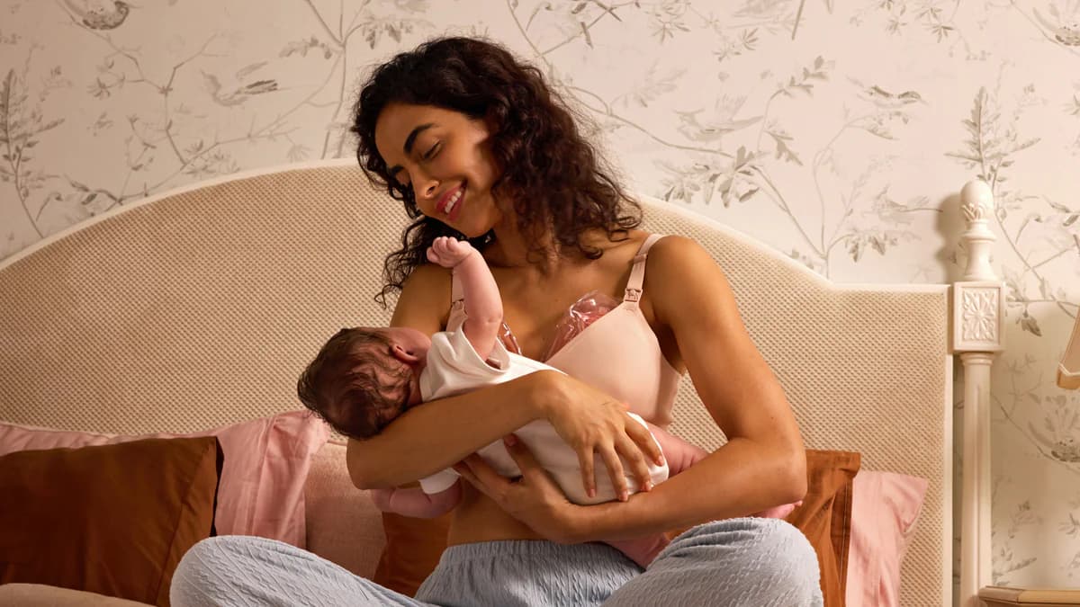 Mom using wearable breast pump while working
